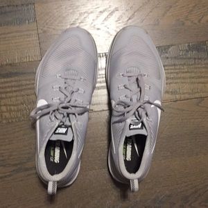 Grey Nike training shoes